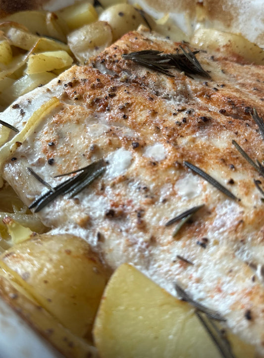 Baked Corvina with potatoes